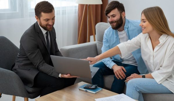 Sellers reviewing their home marketing plan and timeline with their Team Hoover Realty Group agent