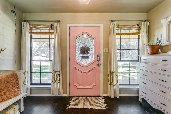 Front entryway with natural light in a Burleson, Texas home toured with first-time buyers