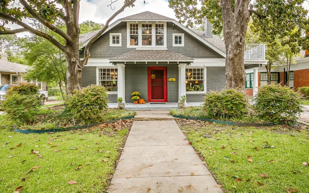 A recently sold craftsman-style home with a red front door in the Fort Worth area